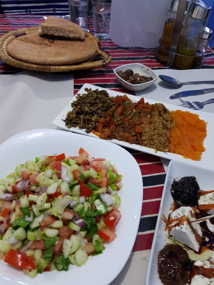 Moroccan dishes with assorted salads and dips on a table setting