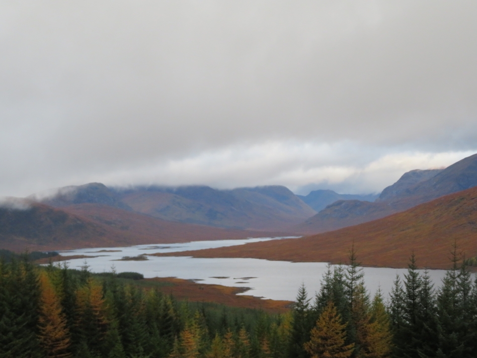 Scenic view of a lake with mountains in the background.