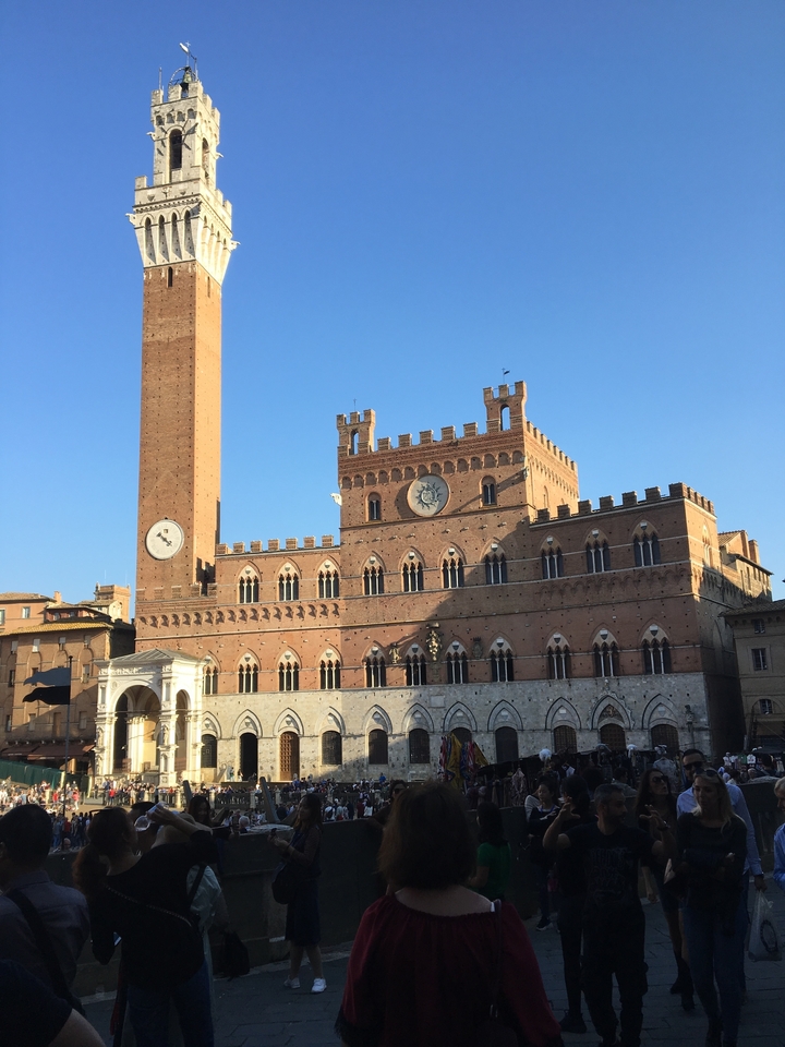 Historic city square with clock tower.