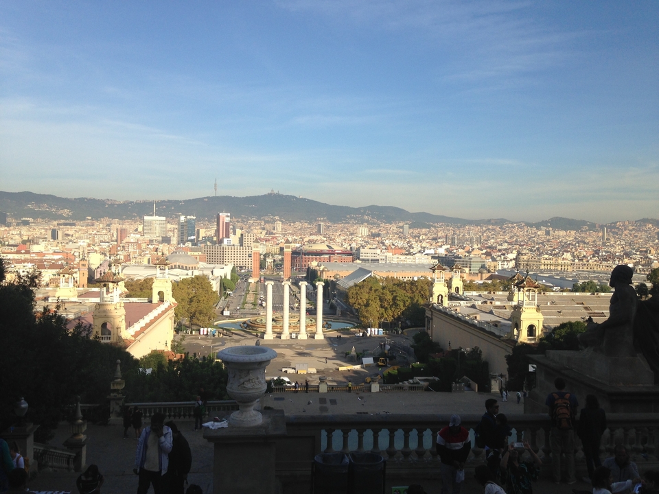 View of Barcelona with columns and distant cityscape.