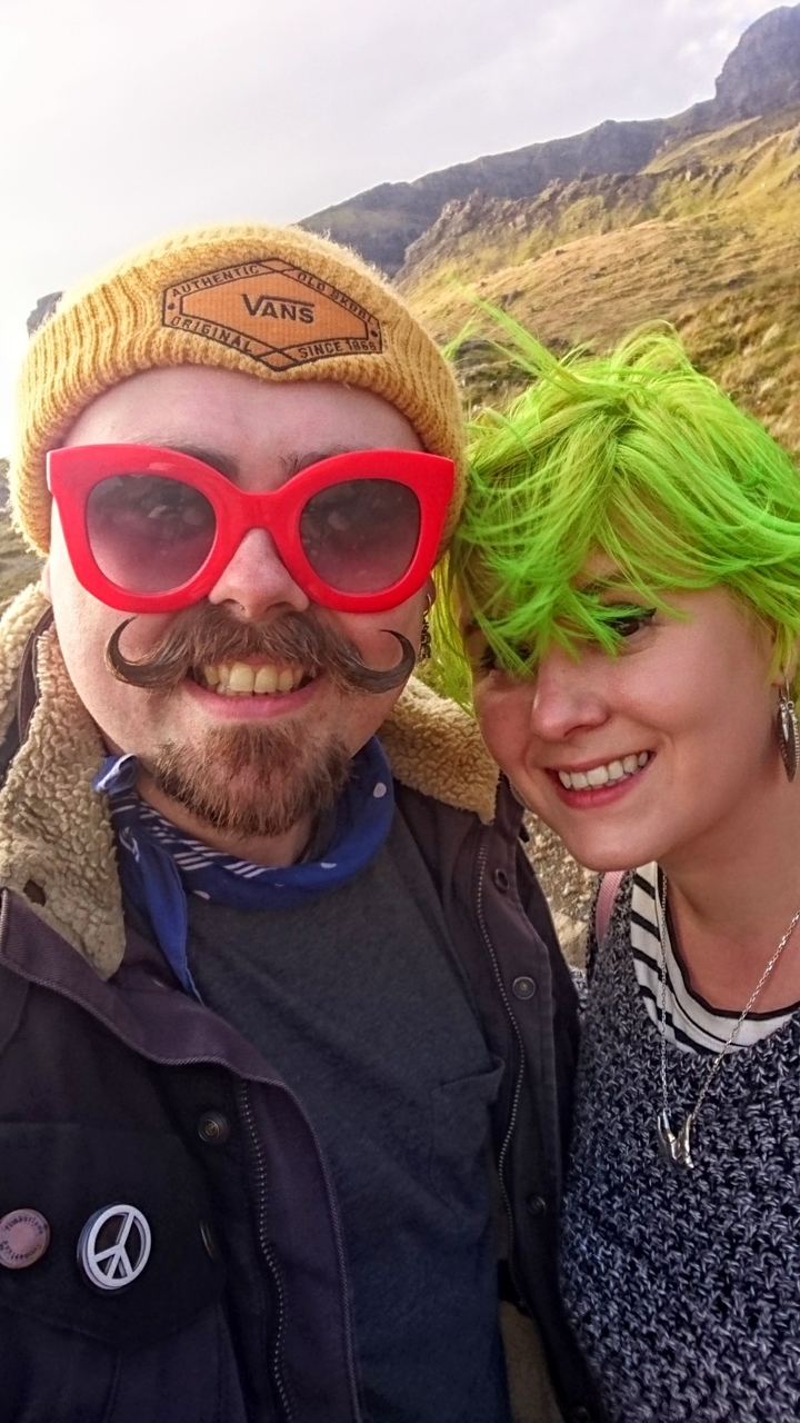 People with colorful costumes and accessories.