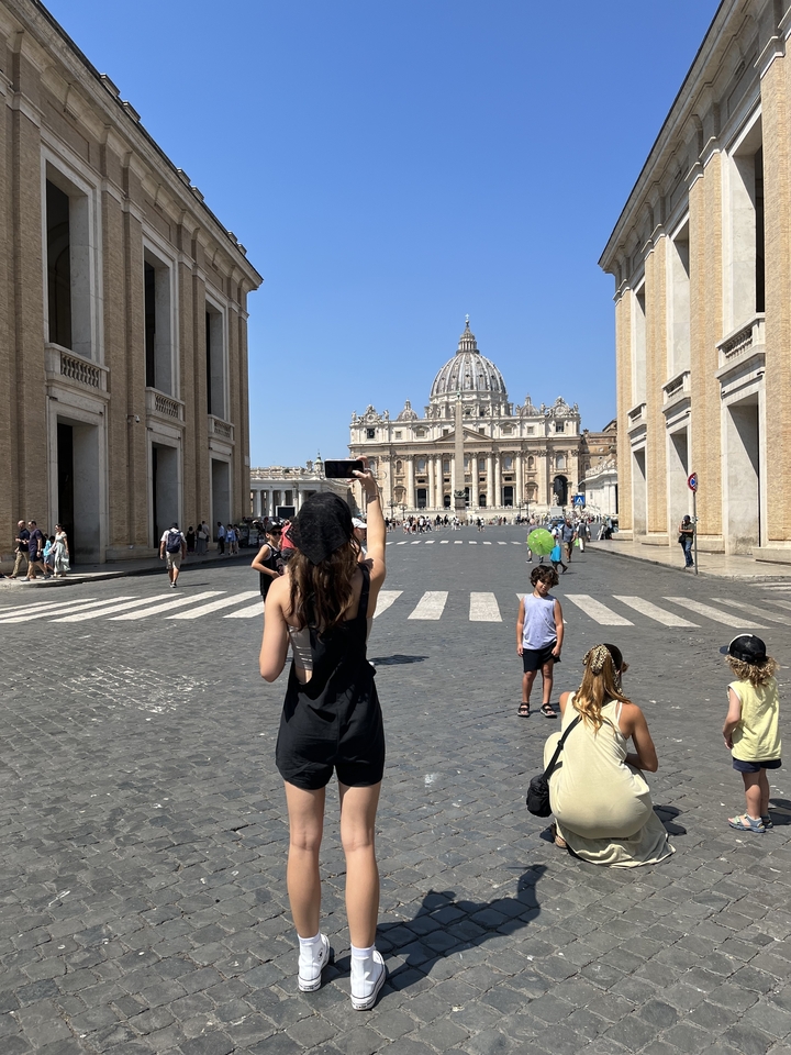 Tourists in front of a grand church building