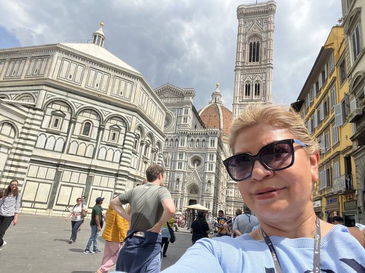 Upside-down view of a historic cathedral with tourists.