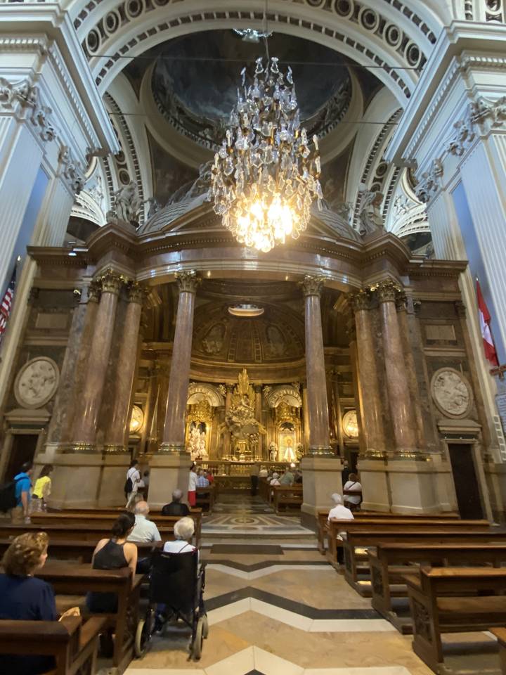 Ornate interior of a church with pews.