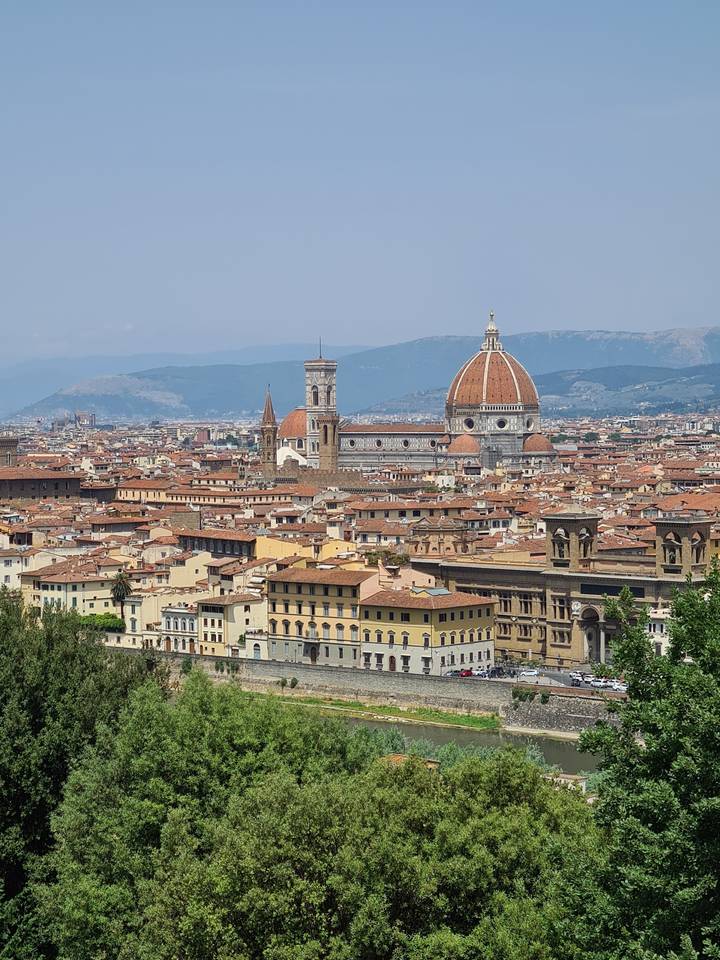 Aerial view of a historic city with a large dome.