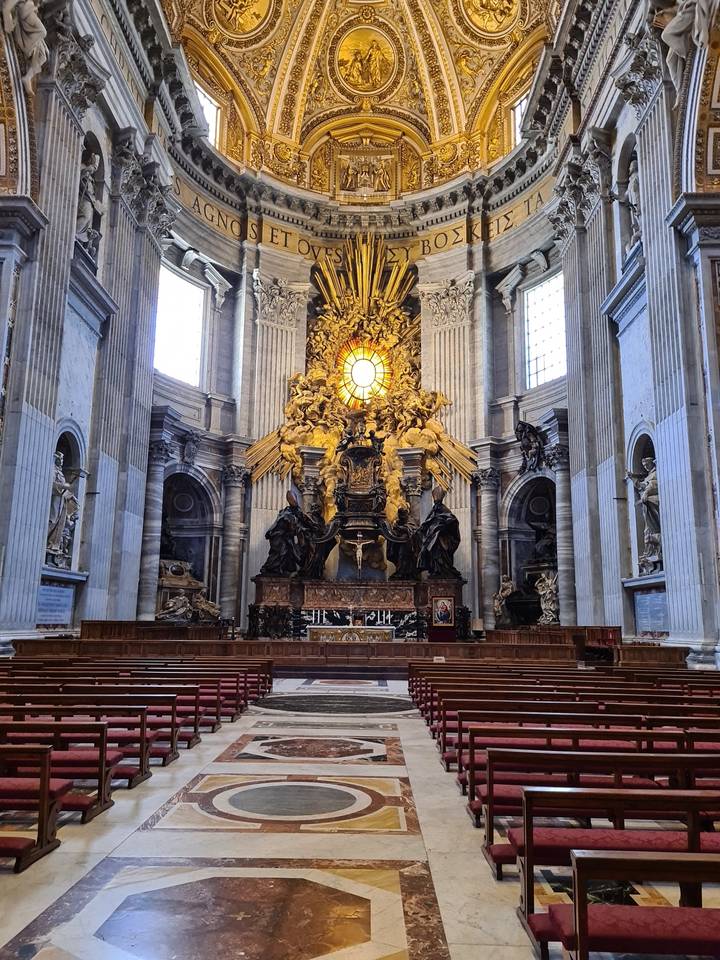 Interior of a church with elaborate decoration and sculptures.