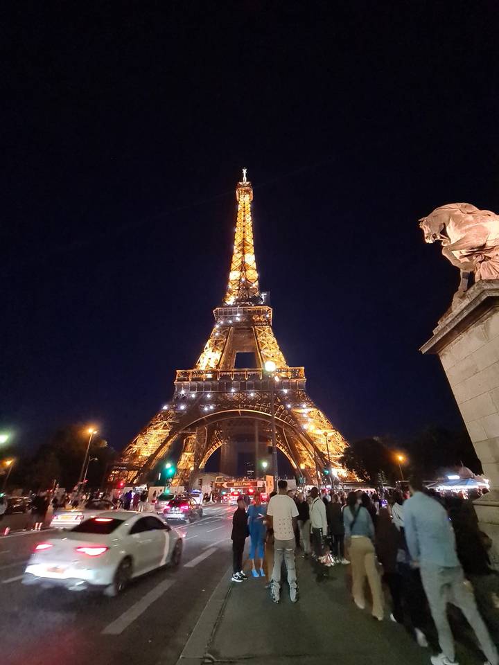 The Eiffel Tower illuminated at night.