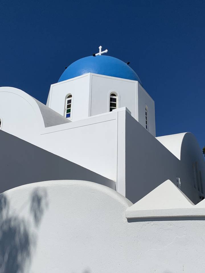 Traditional white building with a blue dome.