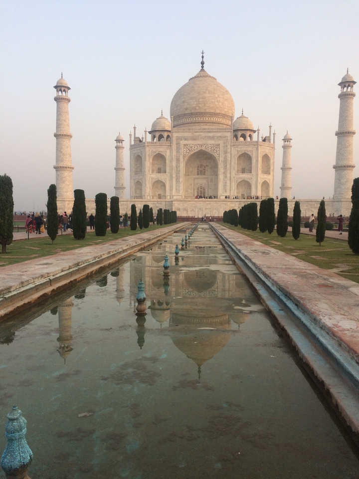 A classic view of the Taj Mahal with its reflection in the pool.