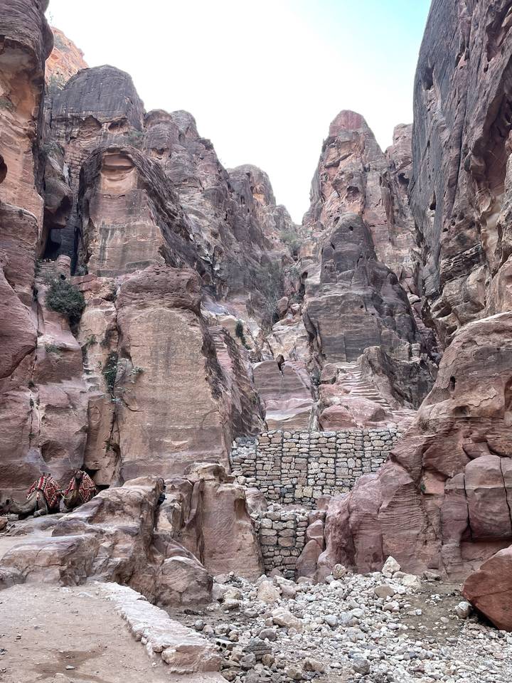 Rocky cliff view with a sunny sky.