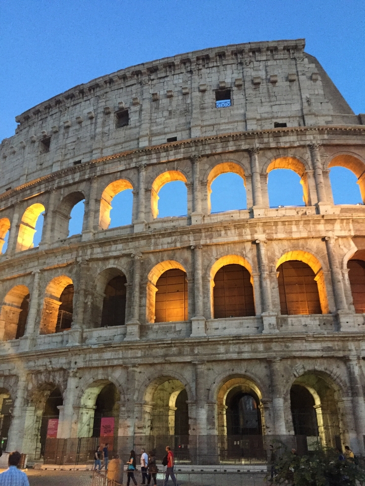 The Colosseum in Rome illuminated at night.
