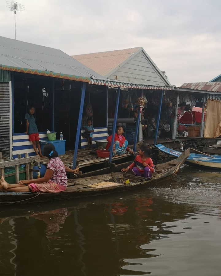 Local people on a floating village by the water.