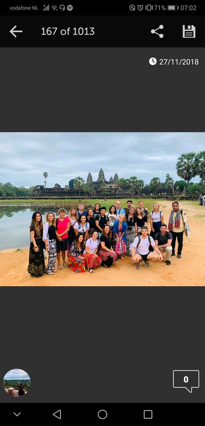 Group posing in front of Angkor Wat.