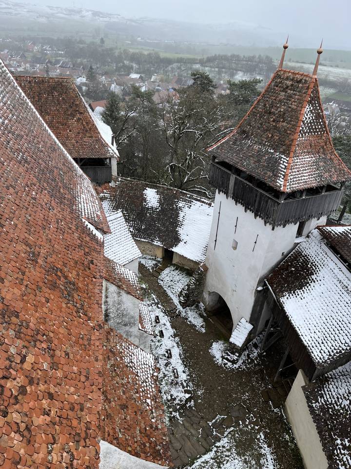 Snow-covered rooftops and medieval architecture.