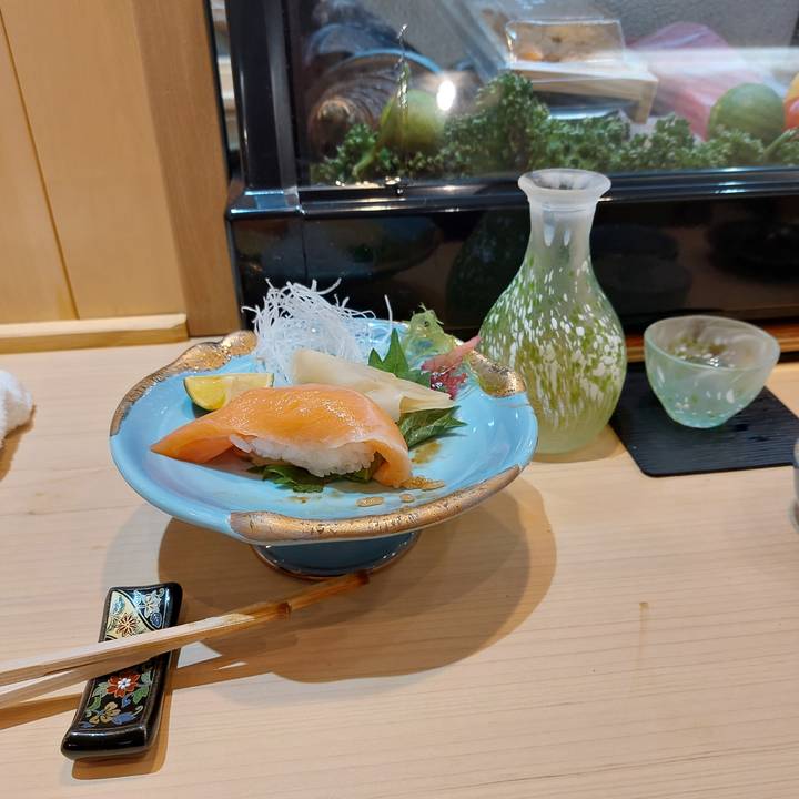 Traditional Japanese meal with sushi on a table.