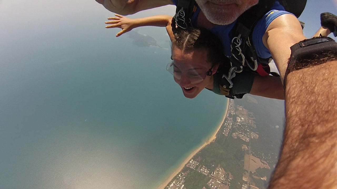 Tandem skydiving over a coastal area