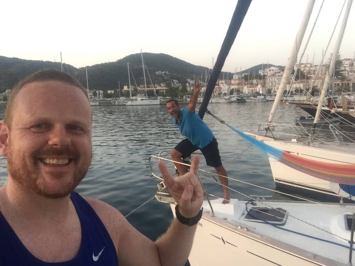 Upside-down image of a man posing on a boat.