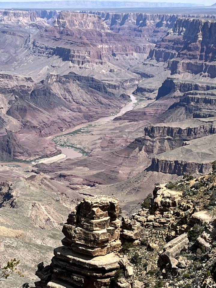 View of the Grand Canyon with steep cliffs and river below