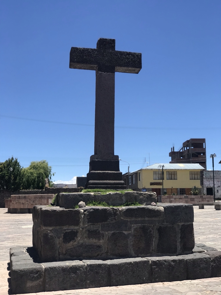 Stone monument in a town square.