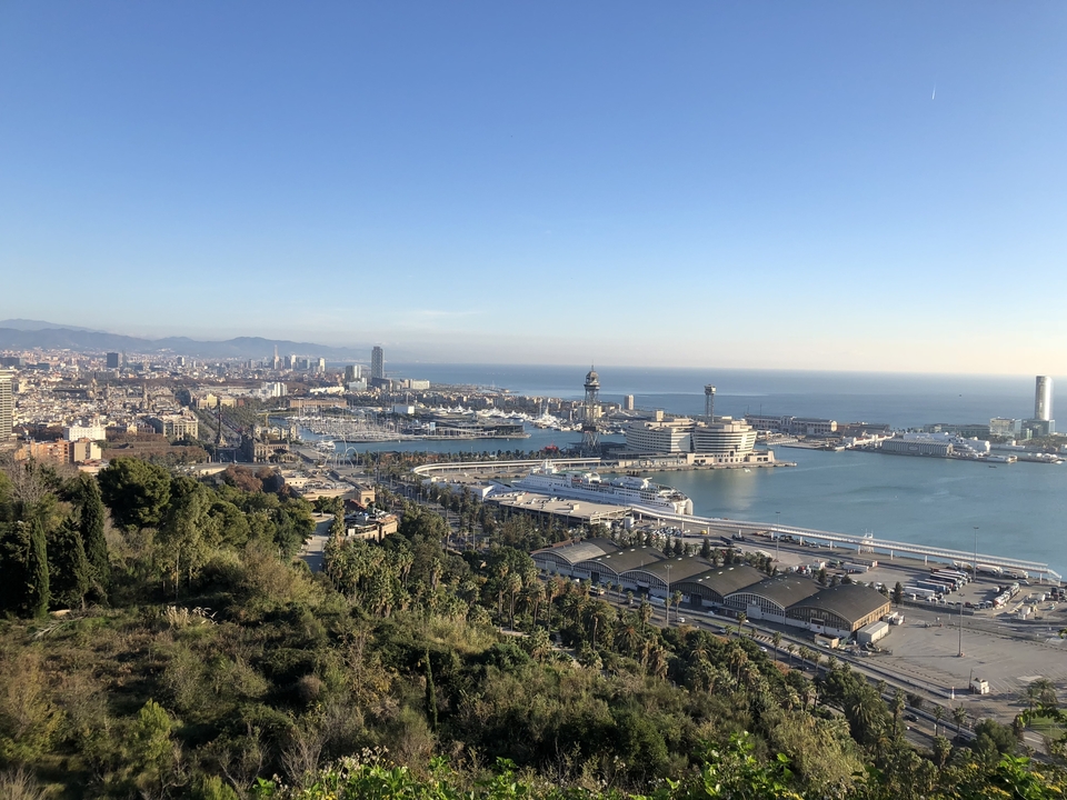 Cityscape and harbor view on a sunny day.
