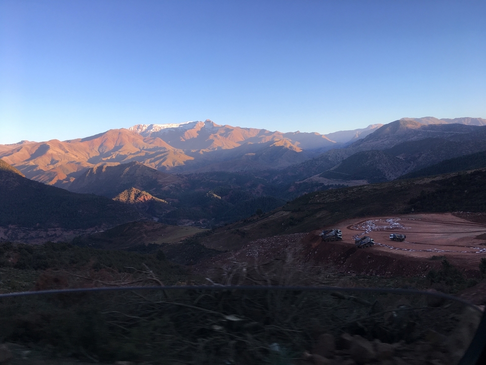 Scenic mountain range under a clear sky.