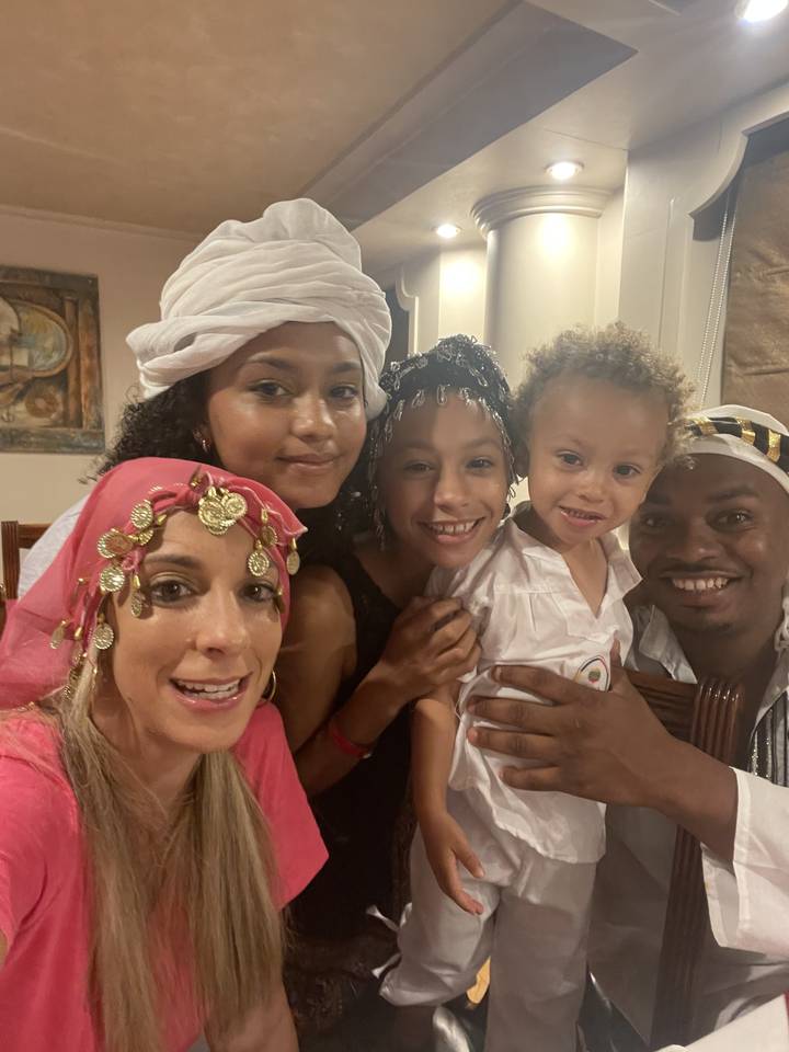 Family taking a selfie indoors.