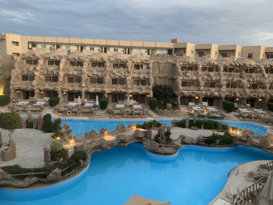 Hotel pool area with unique architecture.