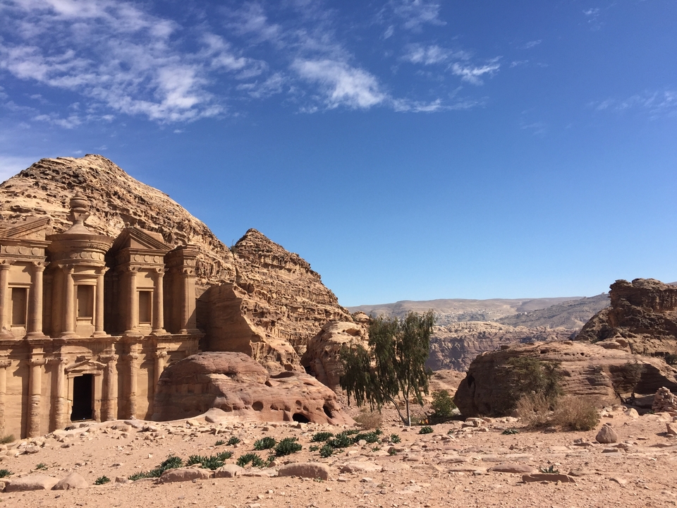 Large group of tourists on a hill.