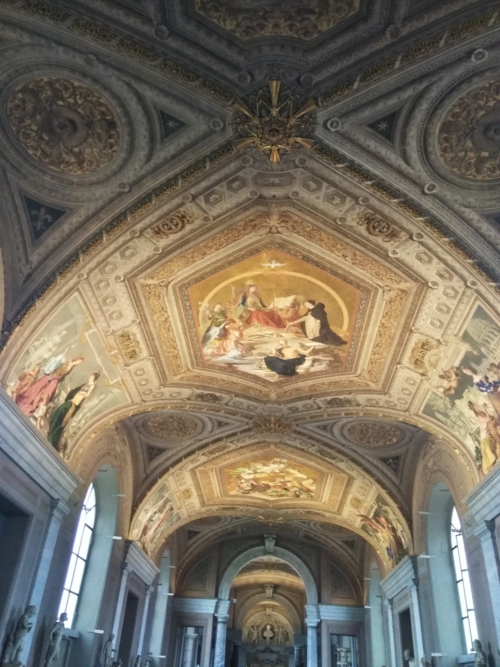 Ceiling with ornate artwork and gilding.