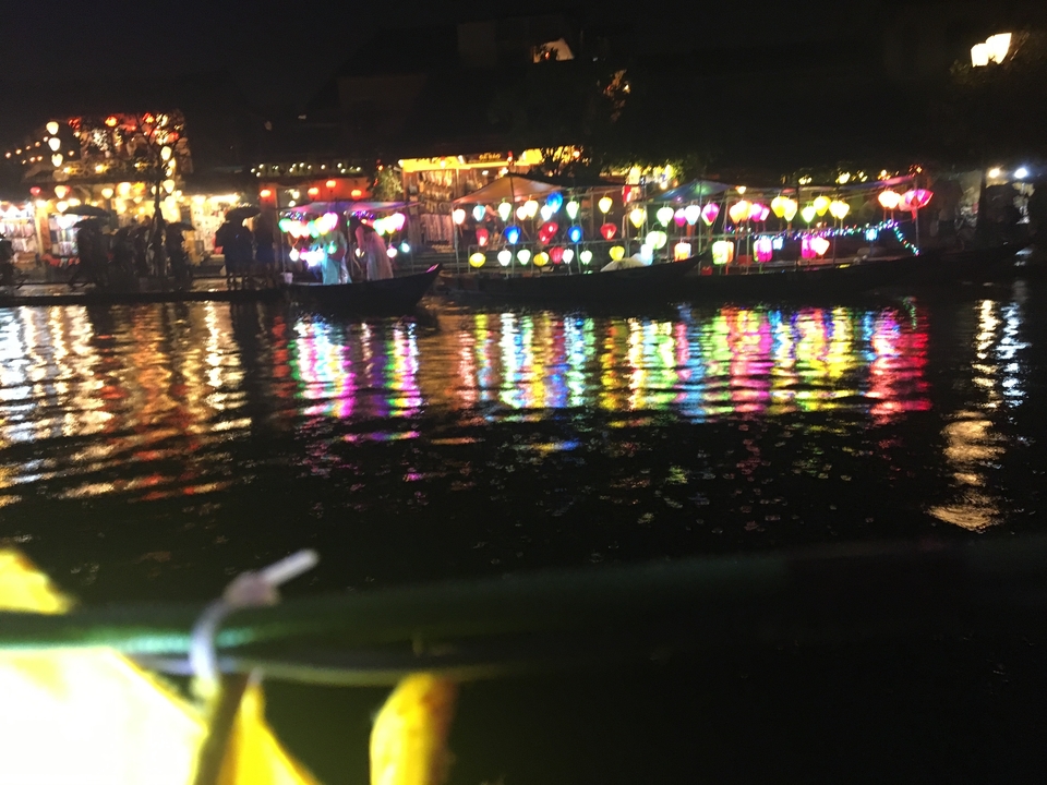 Colorful lanterns on water reflections at night.