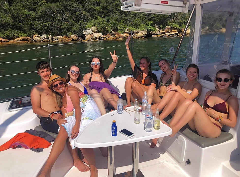 Group of friends relaxing on a boat.