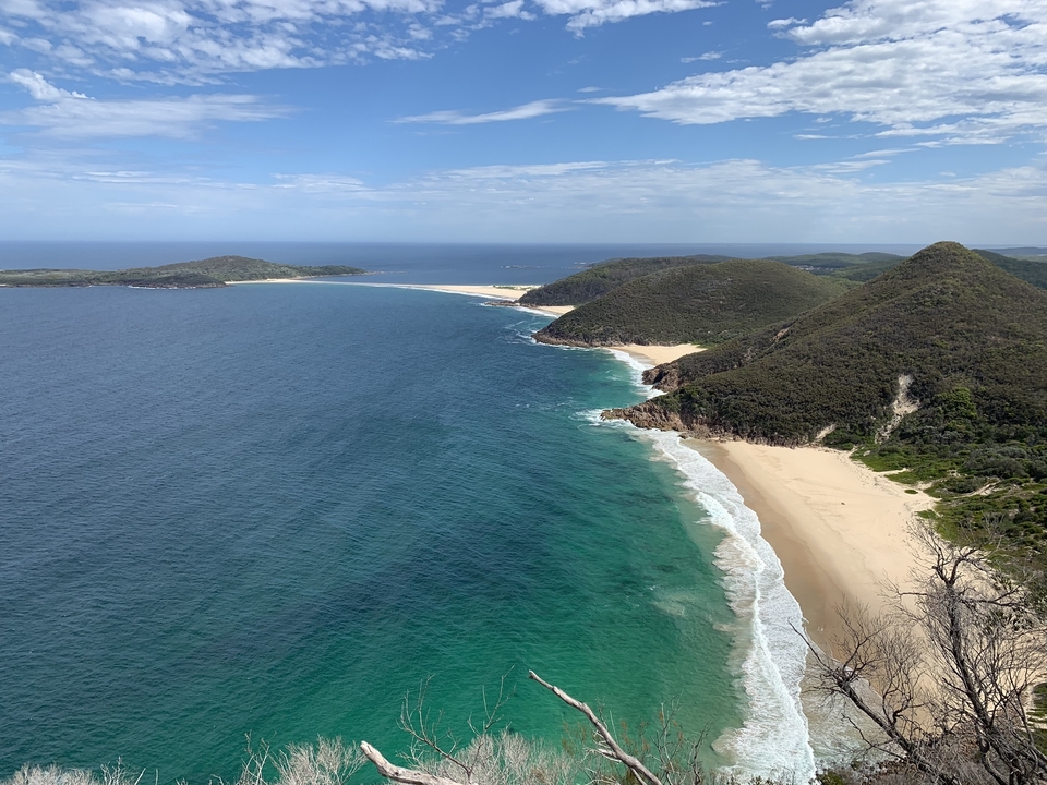 Aerial view of a beach with cape coastline.
