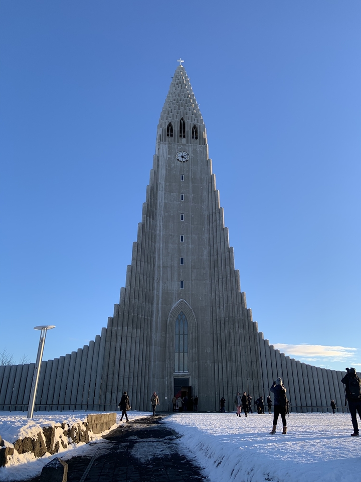 Tall cathedral with a blue sky background.