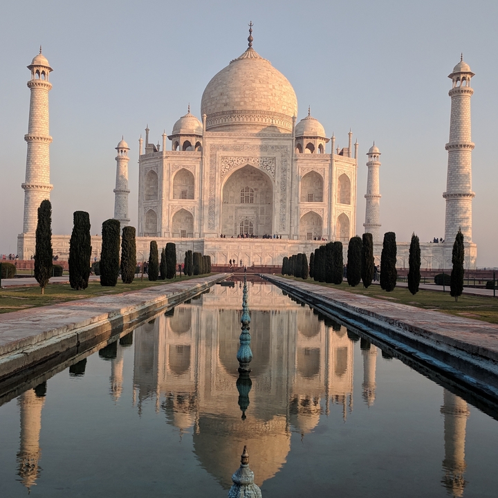 Iconic view of the Taj Mahal with reflection pool.
