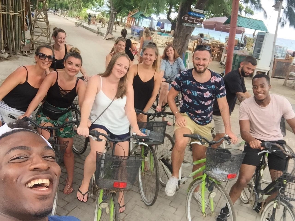 A group of people on bicycles taking a photo.