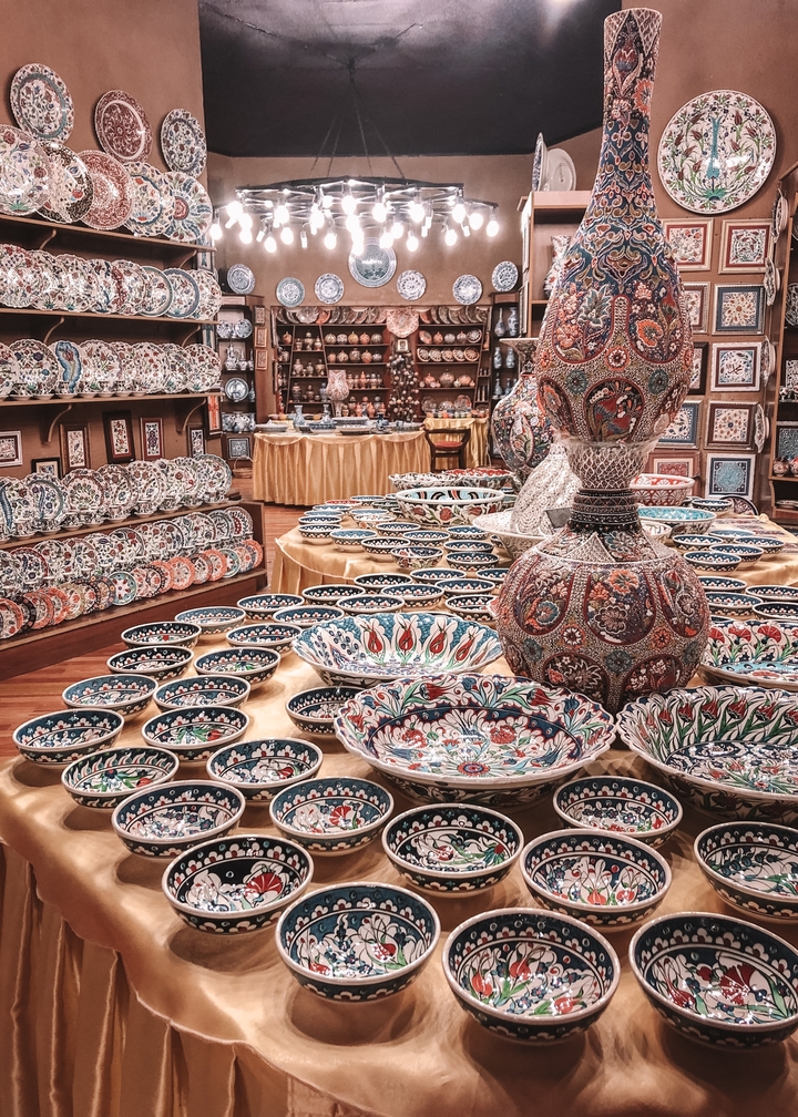 A store filled with colorful traditional ceramics and pottery.