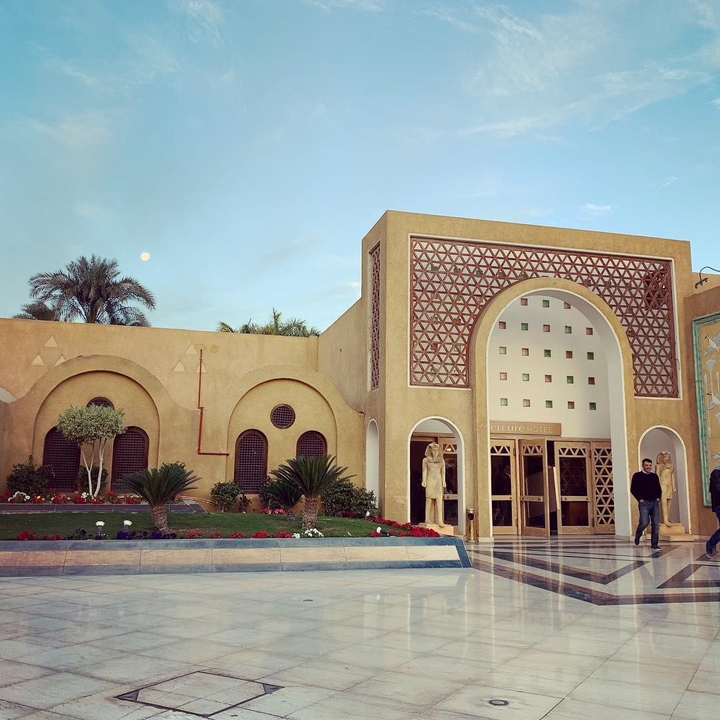 Hotel entrance with traditional architectural designs.