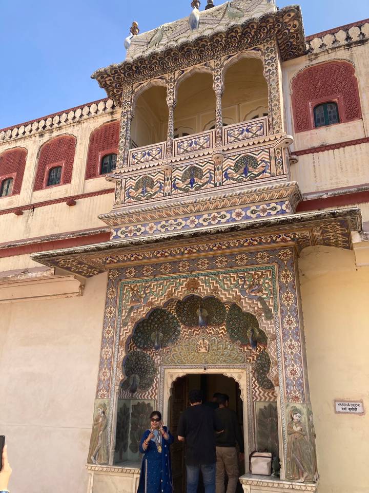 Intricate archway with peacock motifs.