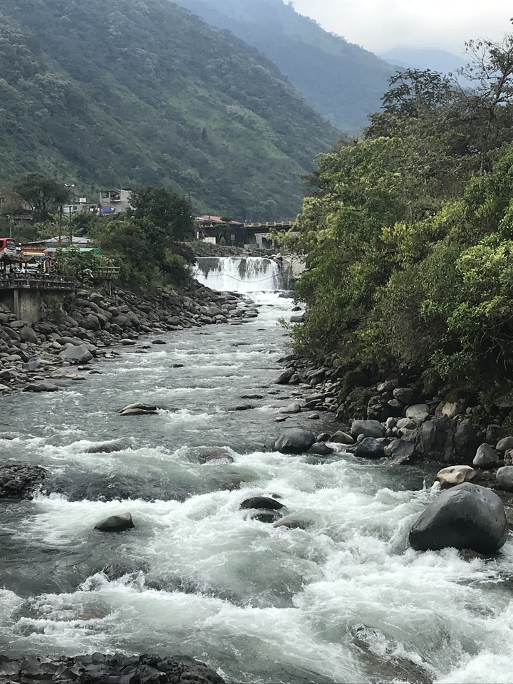 Scenic river with clear flowing water and lush vegetation on the banks.