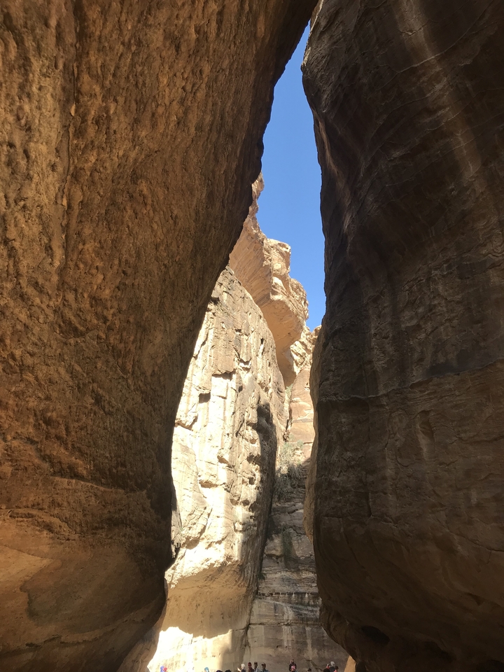 Narrow canyon walls with sunlight.