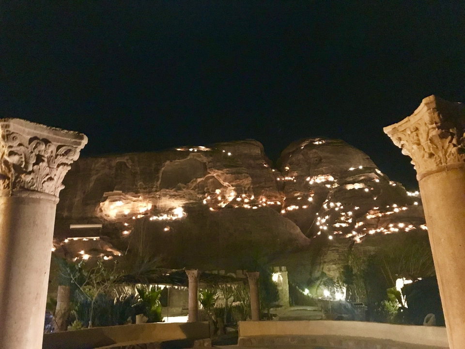 Rock formations illuminated at night in Petra.