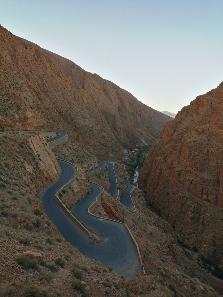 A winding road through the rocky mountains.