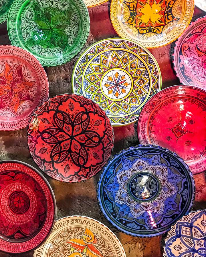 Colorful patterned plates on display.