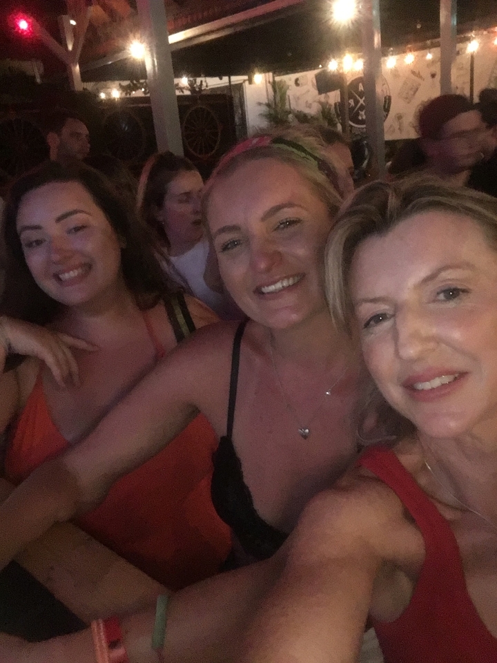 Selfie with three smiling women.