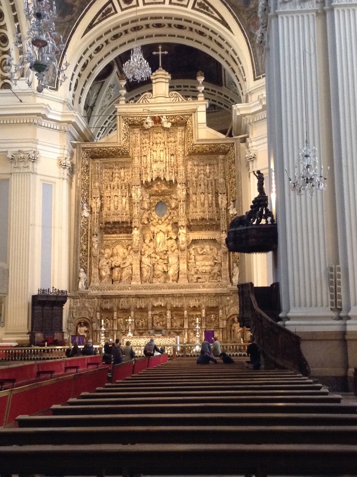Religious altar with intricate golden decorations.