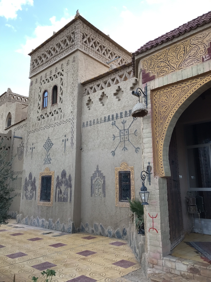 Adobe building with intricate geometric designs.