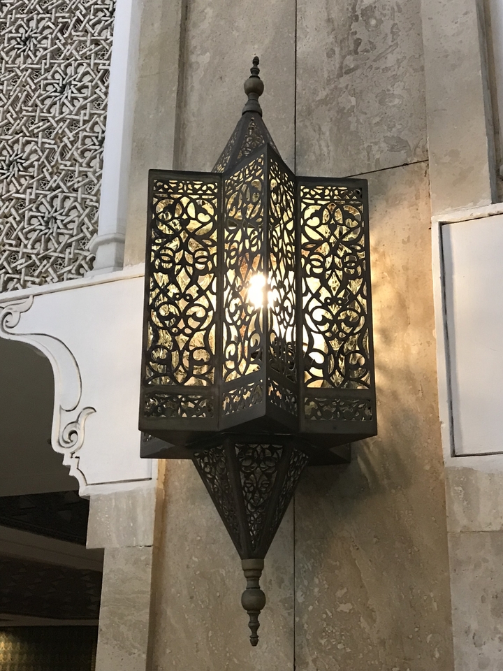 Ornate metal lantern with an intricate design.