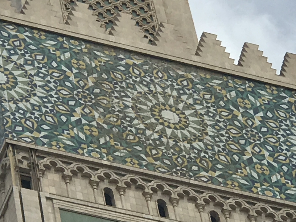 Mosaic artwork on traditional building.