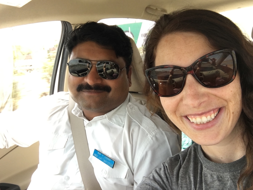 A selfie of two people in a car.