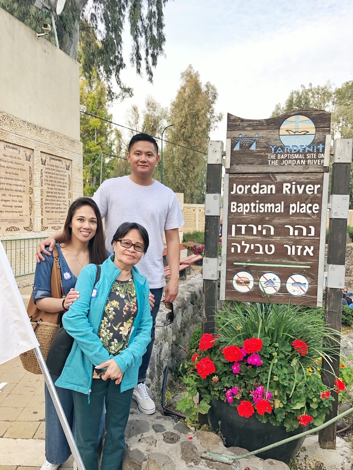 Three people at Jordan River Baptismal site.